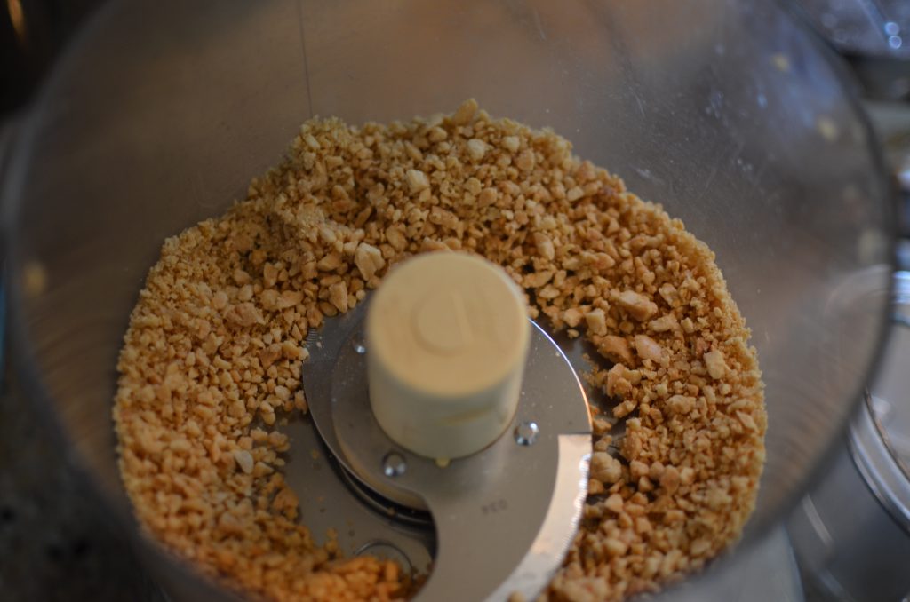 A picture of ground peanuts and sugar after processing.