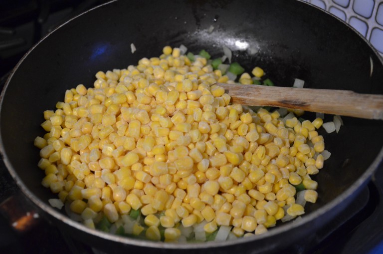 adding frozen corn