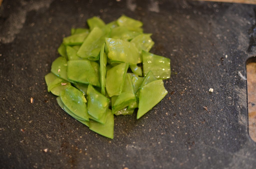 Snow pea pods after being chopped.